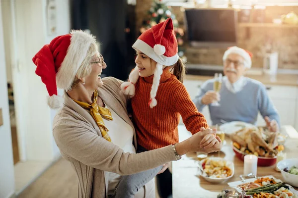 Joyful Senior Woman Dancing Her Granddaughter While Celebrating Christmas Home — ストック写真