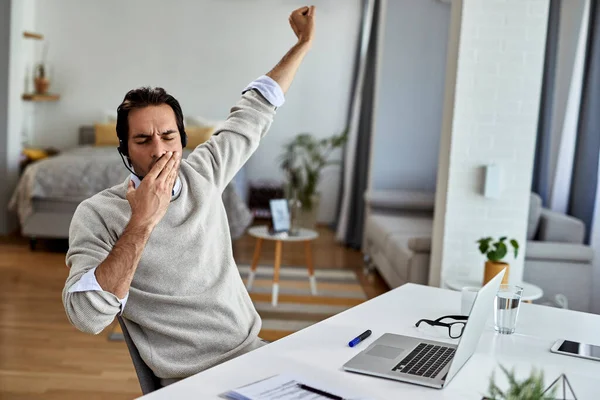 Young Businessman Yawning While Feeling Tired Working Computer Home — Stockfoto