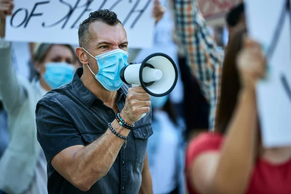 Displeased Man Wearing Protective Face Mask While Participating Protest Shouting — 图库照片