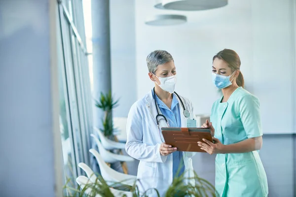 Young Nurse Female Doctor Analyzing Medical Documents While Working Hospital — Foto de Stock