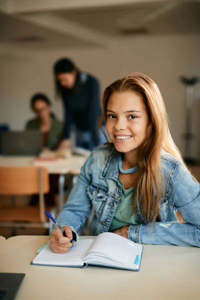 Happy Teenage Girl Taking Notes While Learning High School Looking — Fotografia de Stock