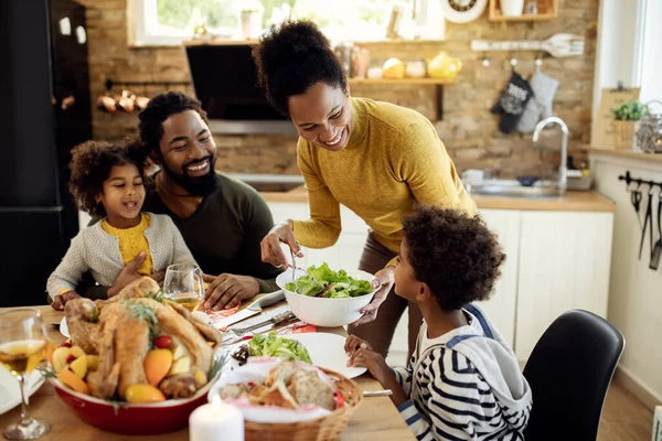 Happy African American Woman Having Thanksgiving Lunch Her Family Serving — Foto de Stock