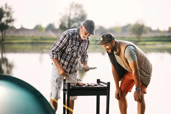 Happy Mature Father His Adult Son Grilling Food Barbecue Grill — 图库照片