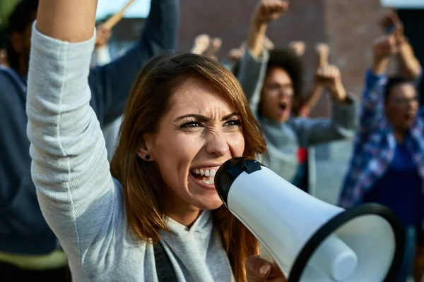 Angry Female Activist Using Megaphone Shouting Public Demonstrations — ストック写真