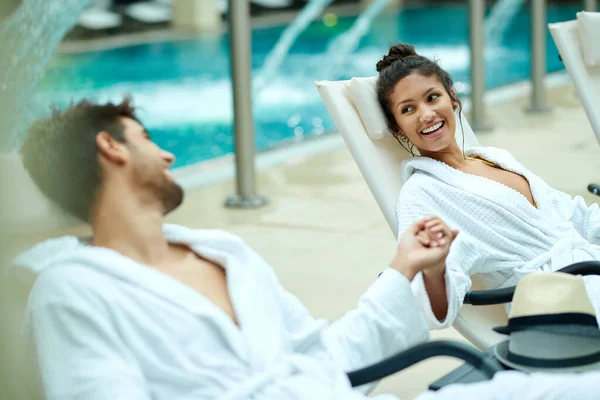 Young Happy Couple Bathrobes Holding Hands While Relaxing Pool Wellness — Stockfoto