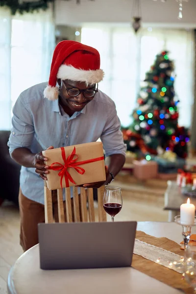 Happy African American Man Showing Wrapped Christmas Present Someone Video — ストック写真