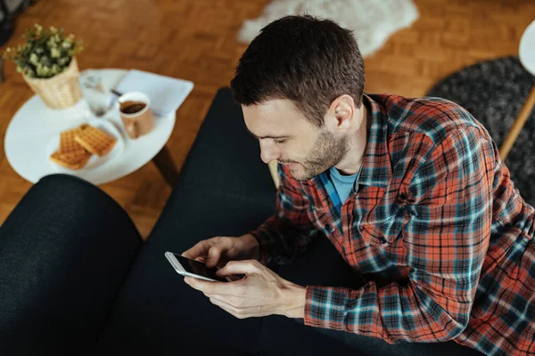 Young Man Relaxing Sofa Texting Smart Phone Living Room — 图库照片