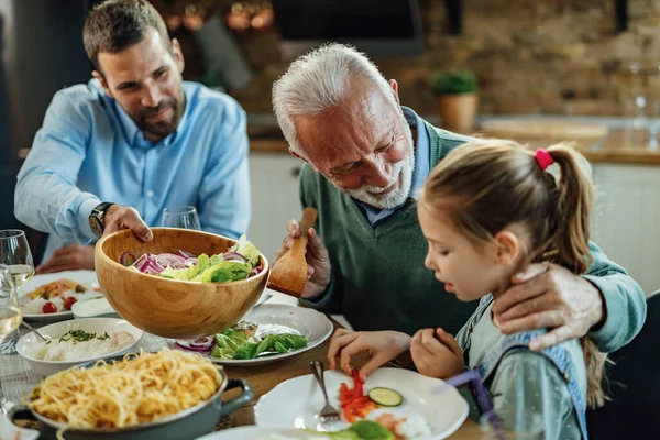 Happy Senior Man Talking His Granddaughter While Having Lunch Dining — Foto Stock