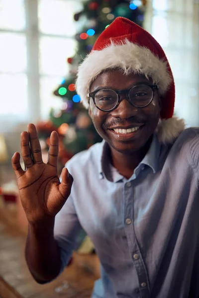 Happy African American Man Congratulating Christmas Video Call Home Waving — Stok fotoğraf