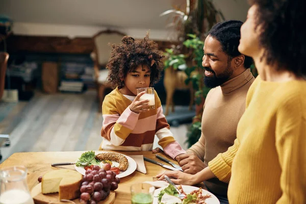 Cute African American Daughter Drinking Milk While Eating Breakfast Parents — Foto de Stock