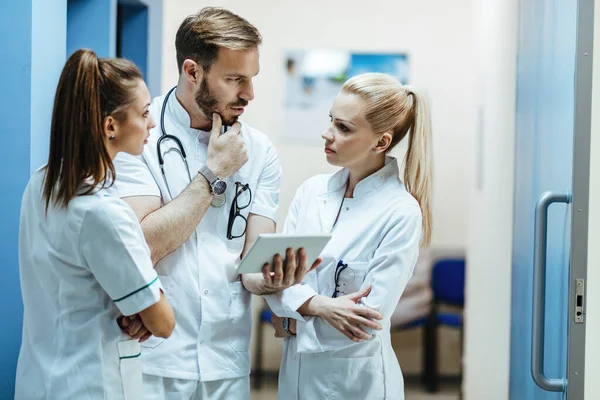 Team Healthcare Workers Cooperating While Using Touchpad Talking Hospital — Foto de Stock