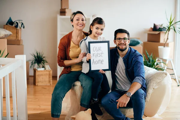 Happy parents with daughter holding \