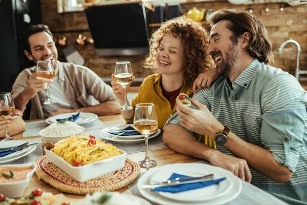 Young Happy Couple Talking Something Funny Laughing While Having Lunch — стоковое фото