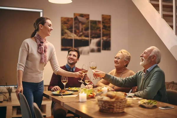 Young Happy Woman Toasting Her Father Law Family Meal Dining — Zdjęcie stockowe