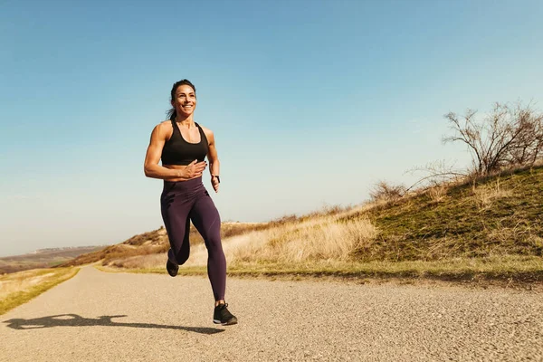 Low Angle View Happy Muscular Build Sportswoman Running Road Copy — Stock Fotó