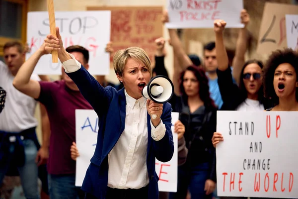 Caucasian Woman Megaphone Shouting While Standing Front Crowd People Protest — Stockfoto