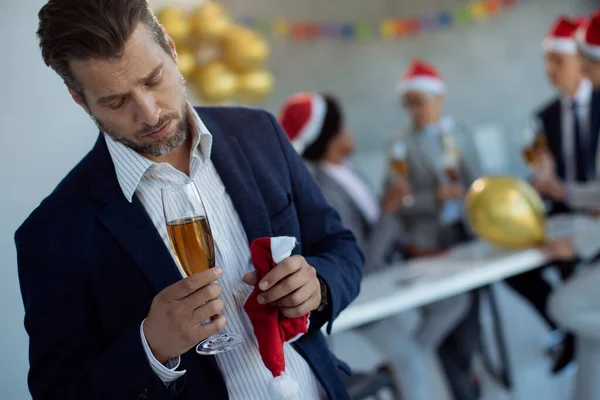 Distraught Businessman Holding Glass Champagne While Standing Apart His Coworkers — ストック写真