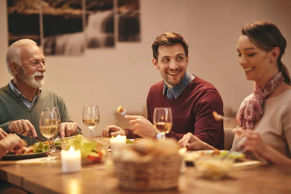 Happy Family Enjoying Conversation Meal Dining Table Focus Young Man — Foto Stock