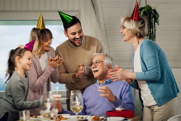 Happy Multi Generation Family Singing While Celebrating Senior Man Birthday — стоковое фото