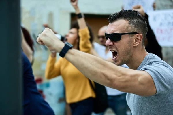 Displeased Caucasian Man Protesting Multi Ethnic Crowd People Streets — Stok fotoğraf