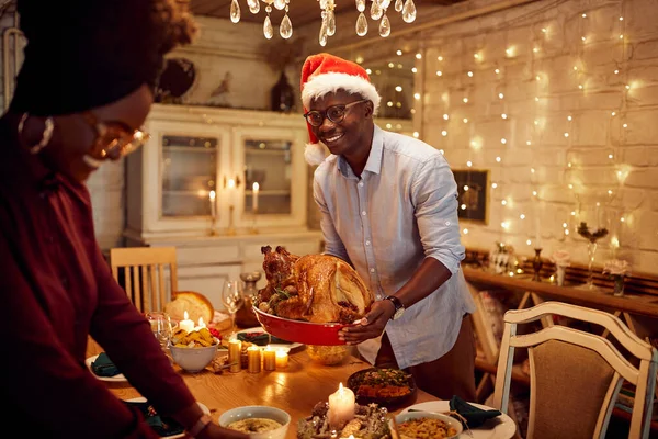 Happy African American Couple Setting Table Christmas Lunch Home Focus — Foto Stock