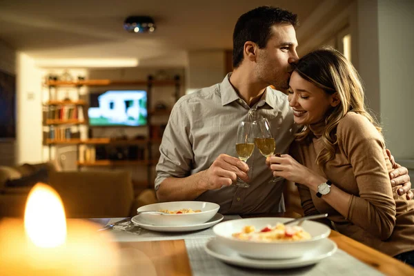 Affectionate Man Kissing His Girlfriend While Toasting Champagne Dinner Dining — стоковое фото
