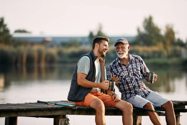 Happy Senior Fisherman His Adult Son Talking While Having Drink — ストック写真