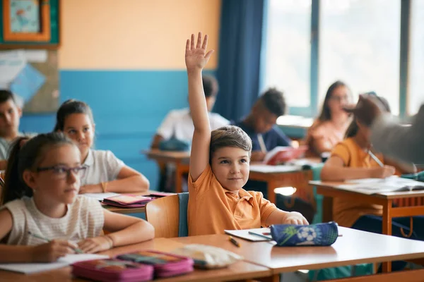 Smiling Elementary Student Raising His Hand Answer Question Class School — Stock Fotó