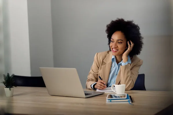 Happy African American Businesswoman Using Computer While Making Conference Call — ストック写真