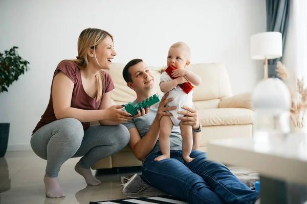 Happy Parents Enjoying While Playing Baby Son Who Chewing Toy — Foto de Stock