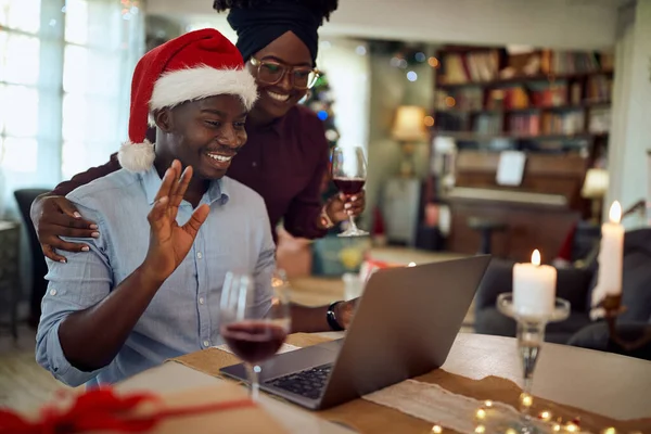 Happy Black Couple Greeting Someone Video Call While Celebrating Christmas — Stock fotografie