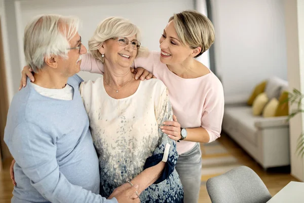 Happy Woman Communicating Her Senior Parents While Visiting Them Home — Photo