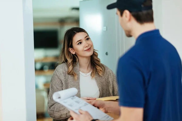 Young Smiling Woman Standing Doorway Communicating Courier While Receiving Home — Stockfoto