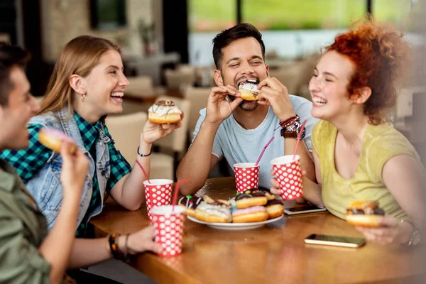 Young Happy Friends Having Fun While Eating Donuts Talking Cafe — Photo