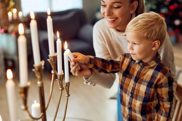 Happy Mother Assisting Her Small Son Light Candles Menorah Hanukkah — Stockfoto