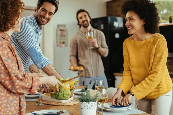 Group Happy Friends Setting Dining Table While Having Lunch Together — Foto de Stock