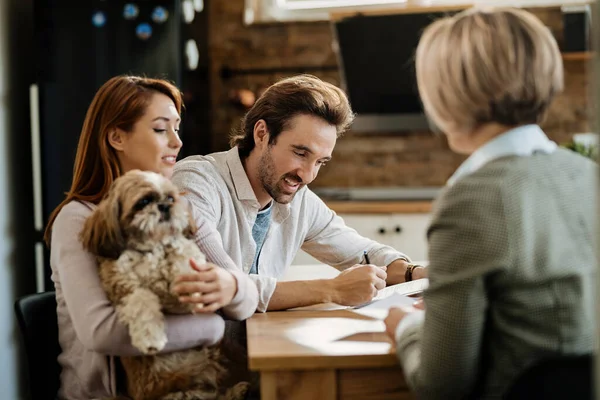 Happy Man Signing Contract While Being His Wife Meeting Financial — Foto Stock