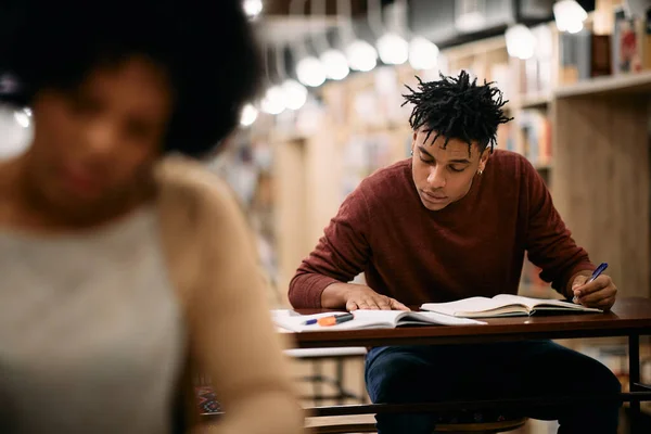 Young African American Student Preparing Exam Studying University Library — Stok fotoğraf