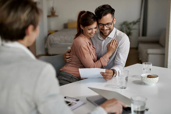 Embraced Couple Reading Agreement While Being Meeting Real Estate Agent — Stockfoto