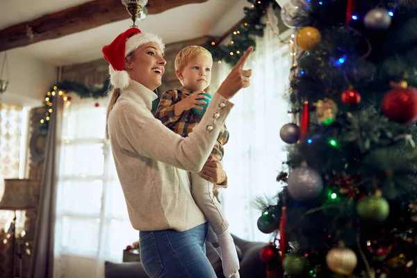 Happy Mother Son Having Fun While Decorating Christmas Tree Living — ストック写真