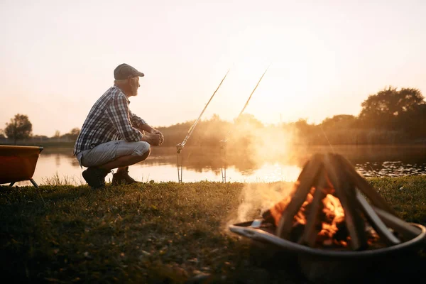 Senior Man Looking View While Fishing Lake Sunset Copy Space — ストック写真