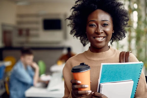 Happy African American Student Holding Books Takeaway Coffee While Going — Stockfoto