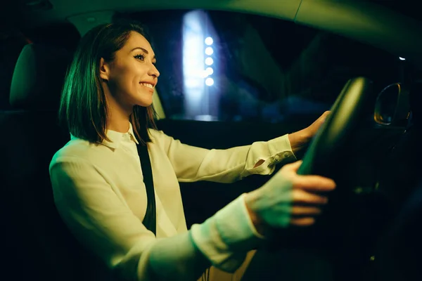 Young Happy Woman Enjoying Night Ride Her Car — стоковое фото