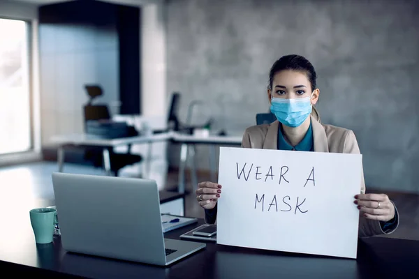 Young Businesswoman Holding Placard Wear Mask Appeal While Working Office — 스톡 사진