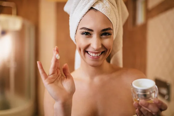 Beautiful Woman Using Face Cream Looking Camera Bathroom — 图库照片