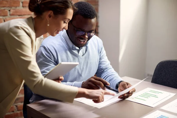 Happy African American Businessman His Female Colleague Analyzing Documents Meeting — Foto de Stock