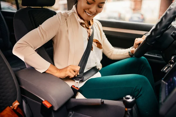 Happy Asian Businesswoman Fastening Seatbelt While Driving Car — Stok fotoğraf