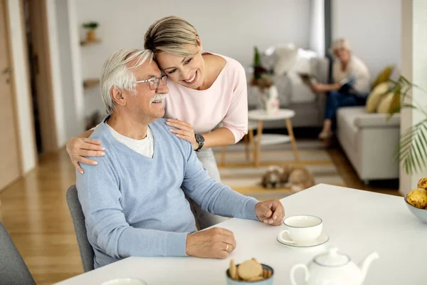 Happy Mature Man Enjoying While His Adult Daughter Embracing Him — Photo