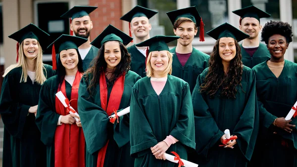 Large Group Happy University Students Gowns Graduation Day Looking Camera — Foto Stock