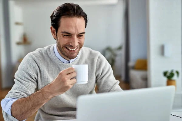 Young Happy Businessman Working Computer While Drinking Coffee Home — Stockfoto